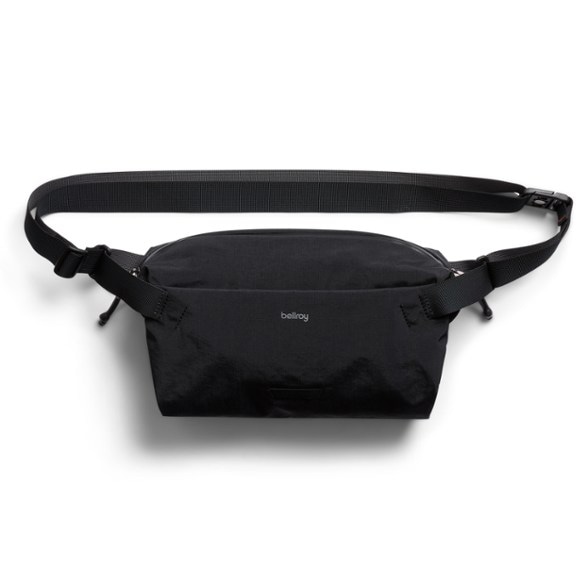 Zenith 7L Go-Lite sling bag in Arcade Gray, worn across the chest, showcasing its sleek profile and accessibility.