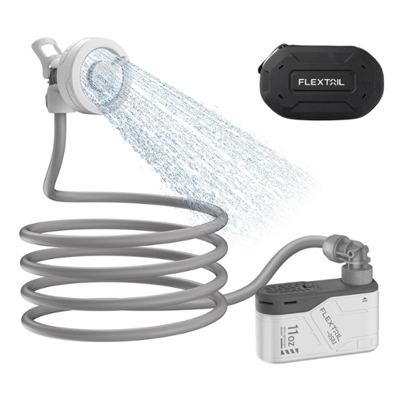 Flextail Max Portable Shower in use at a campsite, showing water flow and compact design