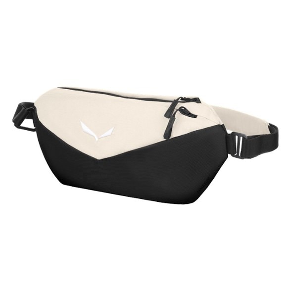 Salewa Fanes sling bag worn crossbody with passport and phone visible in pocket
