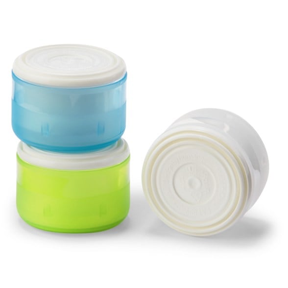 GoTubb containers in use with pills and spices, showing one-handed operation