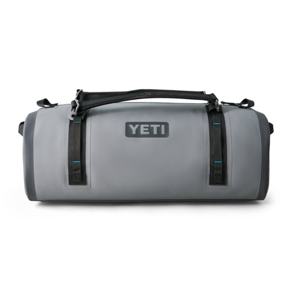 Front view of AdventureGuard 75L waterproof duffel bag on a kayak, displaying its rugged design.