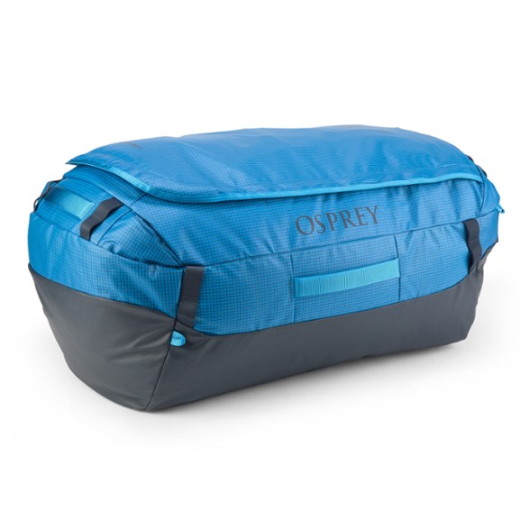 Osprey Transporter 95L duffel bag in action during a camping trip, showcasing its waterproof features.