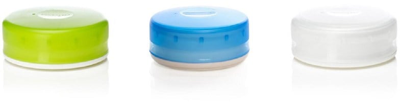 Top view of reusable storage containers holding pills, spices, and snacks